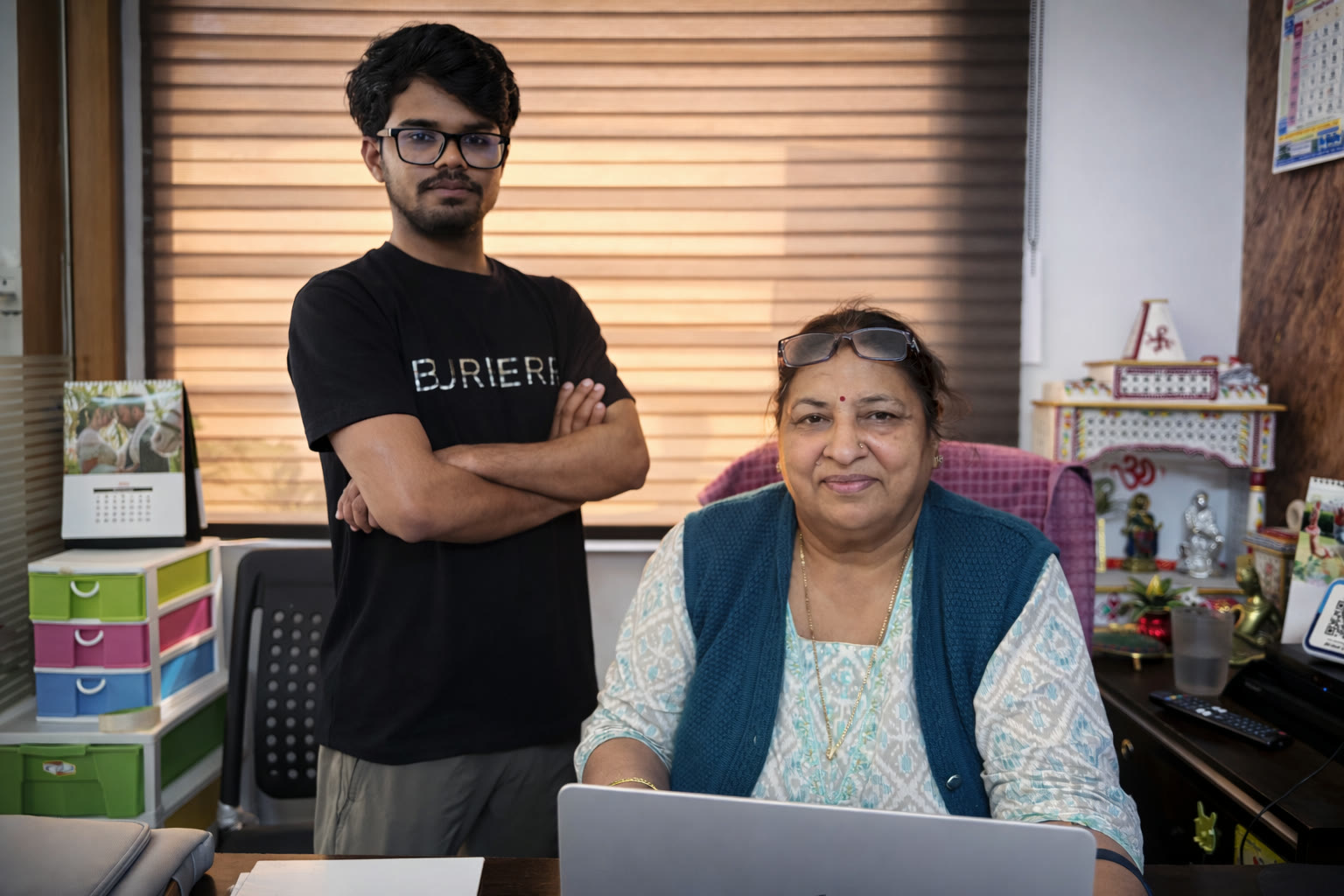 An Inook AI team member with a business owner at her office desk